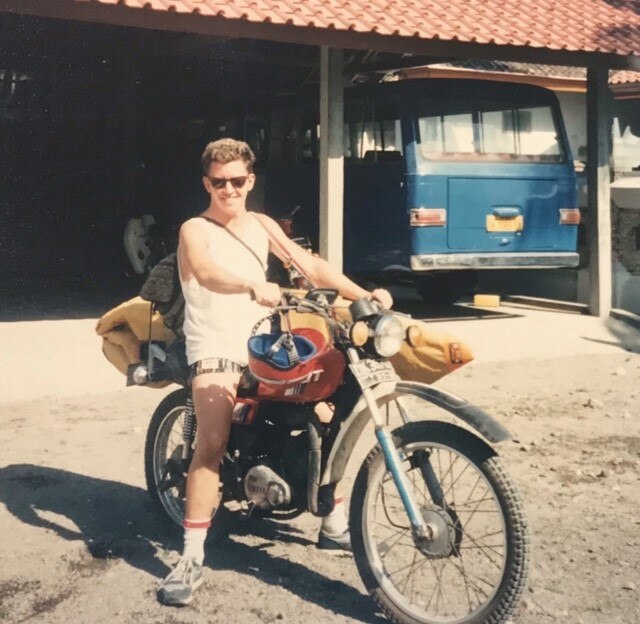 Paul Smith in his 20s on a motorbike