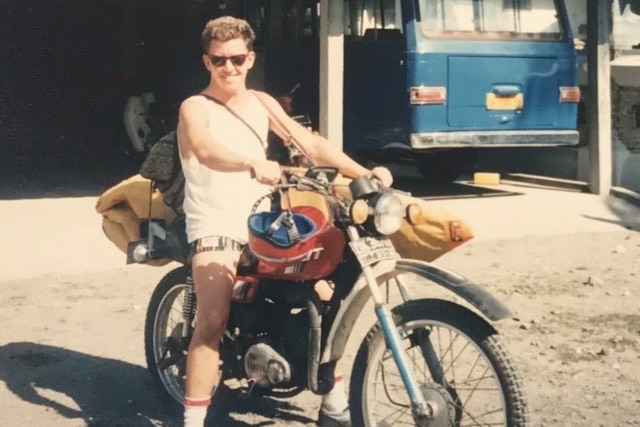 Paul Smith in his 20s on a motorbike