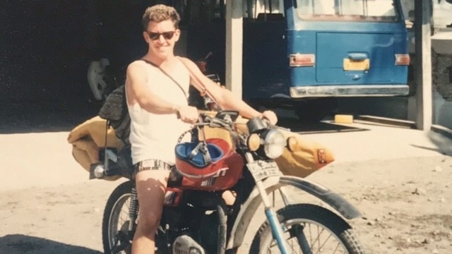 Paul Smith in his 20s on a motorbike