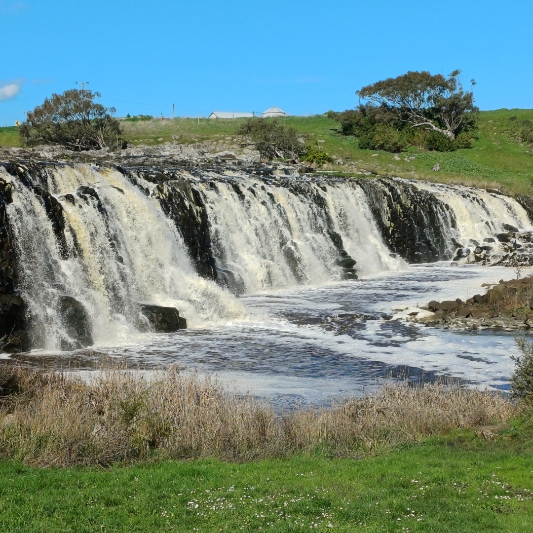 A very wide waterfall with multiple streams.