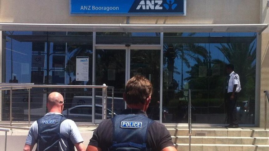 Police head towards the ANZ bank