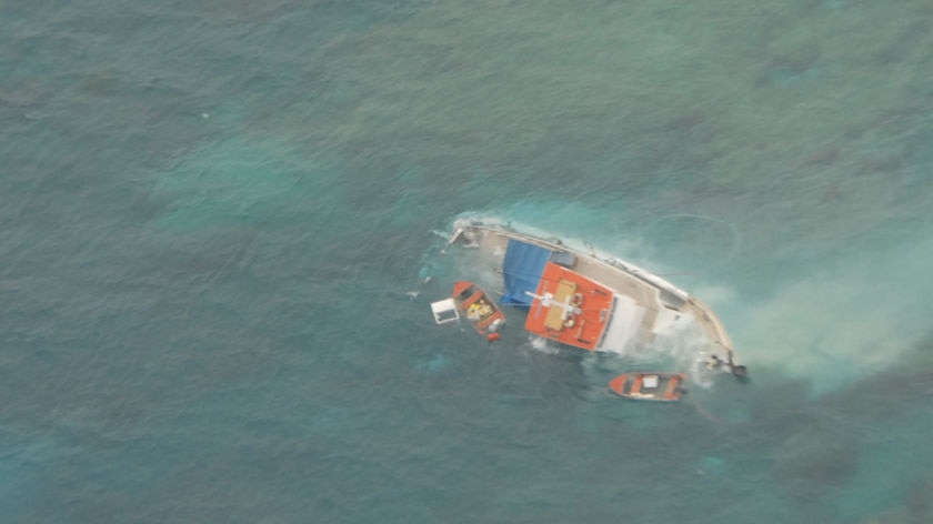 The Bell Cay overturned at Swain Reefs, 250 kilometres off Rockhampton, just after 4am AEST in bad weather.