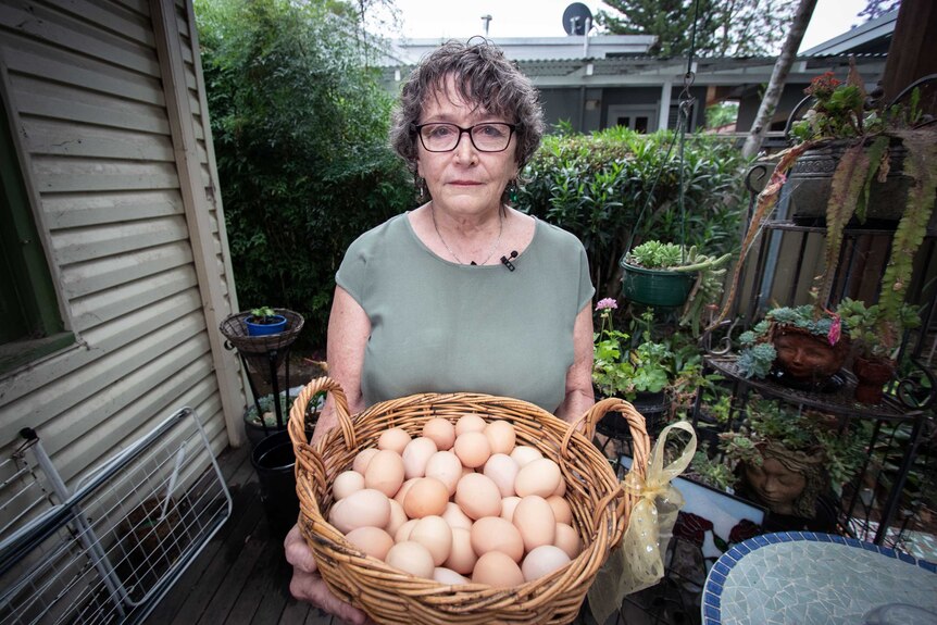 Joanna Pickford holding a basket of eggs.