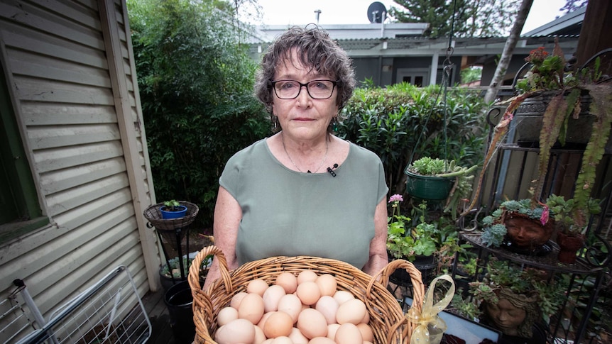 Joanna Pickford holding a basket of eggs.