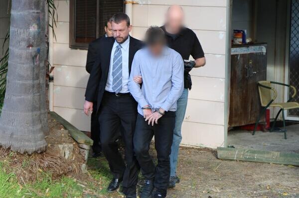 Detectives from strike force Knead arresting a man on the state's Central Coast yesterday.