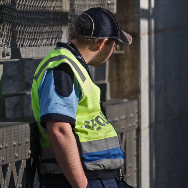 A security guard watches