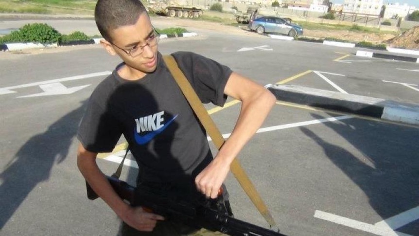 A 2012 photo showing a young Hashim Abedi holding a gun.