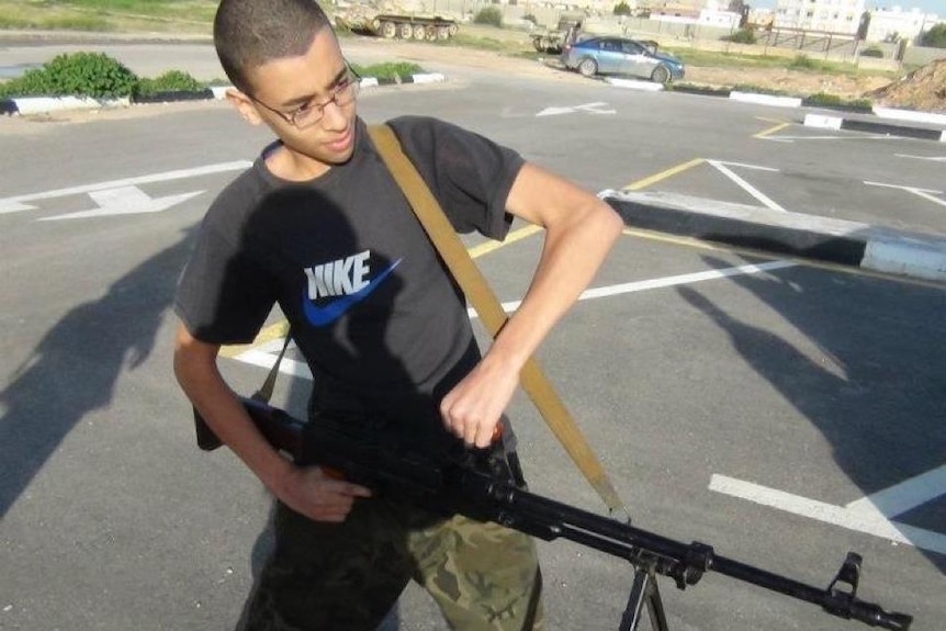 A 2012 photo showing a young Hashim Abedi holding a gun.