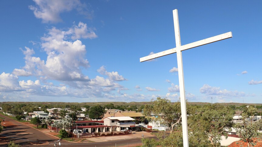 A large cross on a hill overlooking the town of Tennant Creek. 