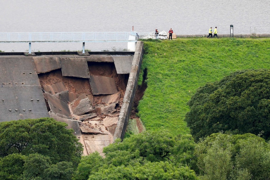 an aerial view of the damage to the dam