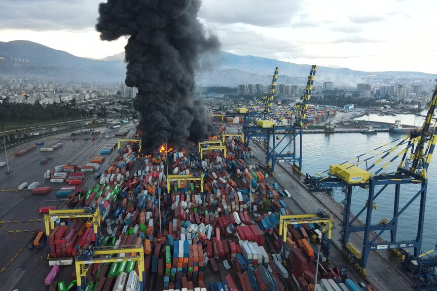 Black smoke from a fire is seen at the Iskenderun port.