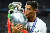 Cristiano Ronaldo kisses the Euro trophy