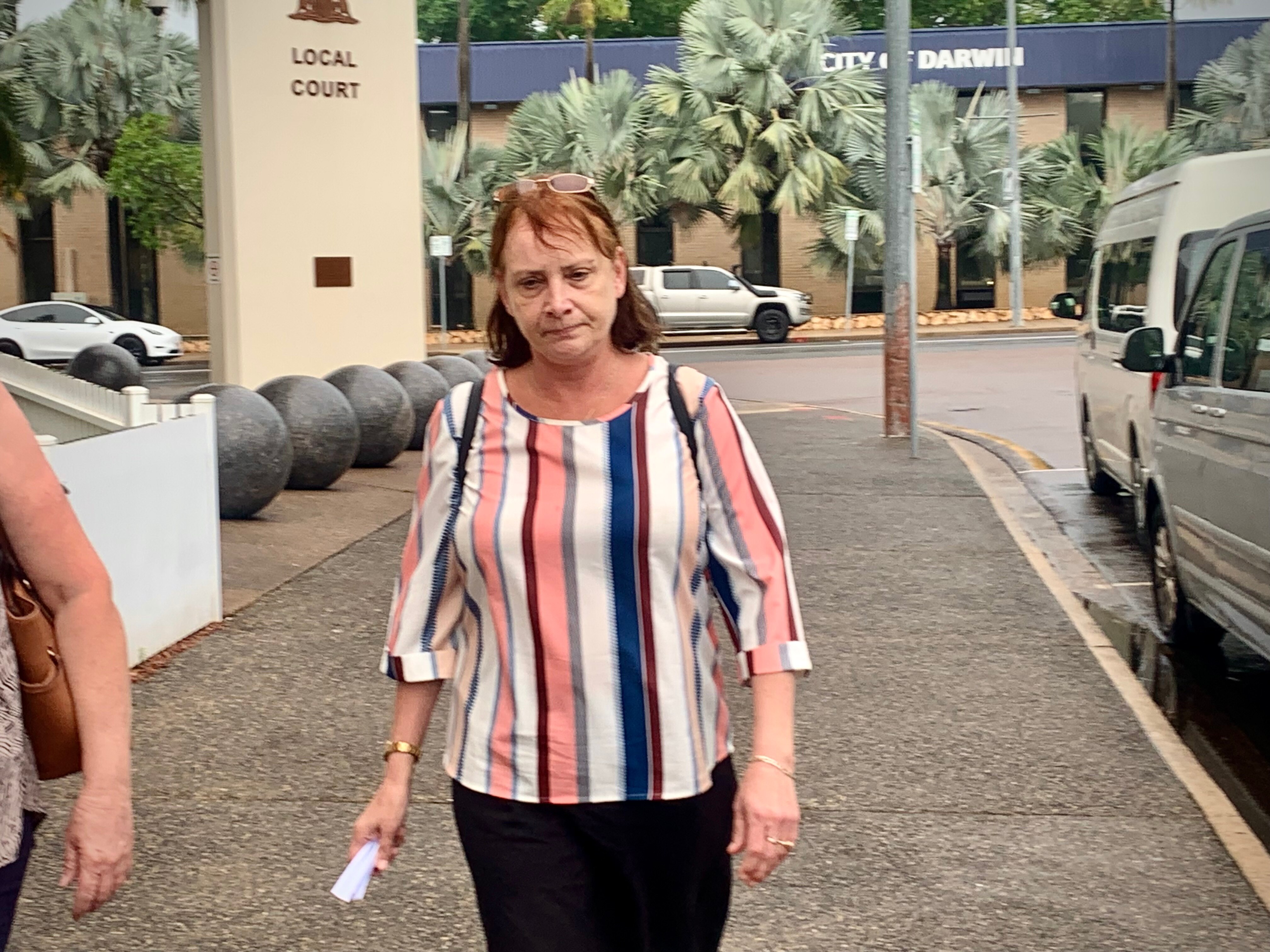 A woman walks out of the Darwin Local Court 