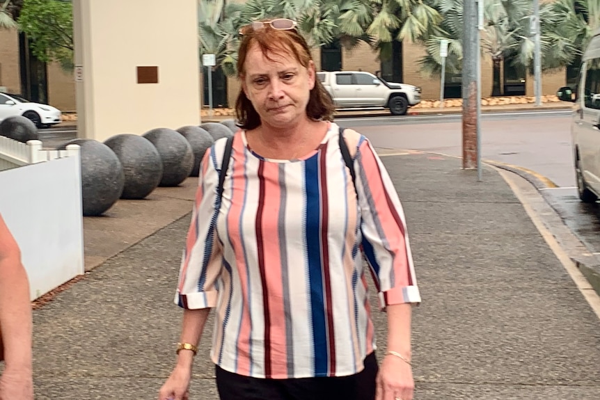 A woman walks out of the Darwin Local Court 
