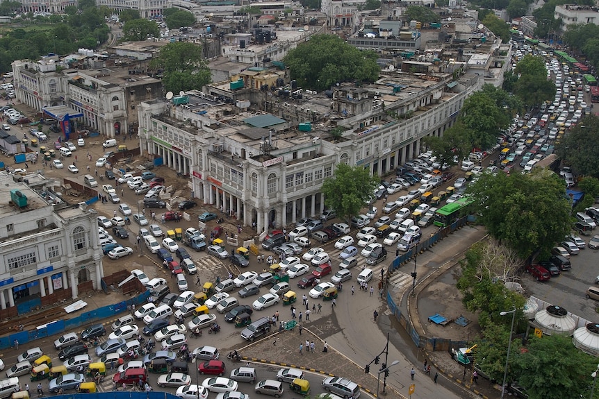 Traffic crawls in Connaught Place in New Delhi as the traffic flow worsened in the afternoon after signals stopped functioning.