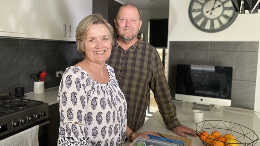 Joanne and Stephen Grosser stand in their kitchen in their home near Ipswitch, Queensland