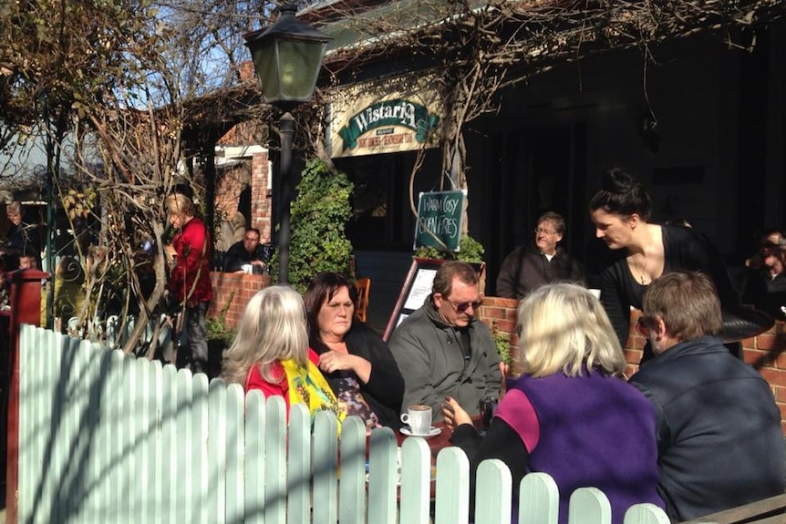 Diners are being served at a table outside Echuca's Wistaria cafe in 2013.