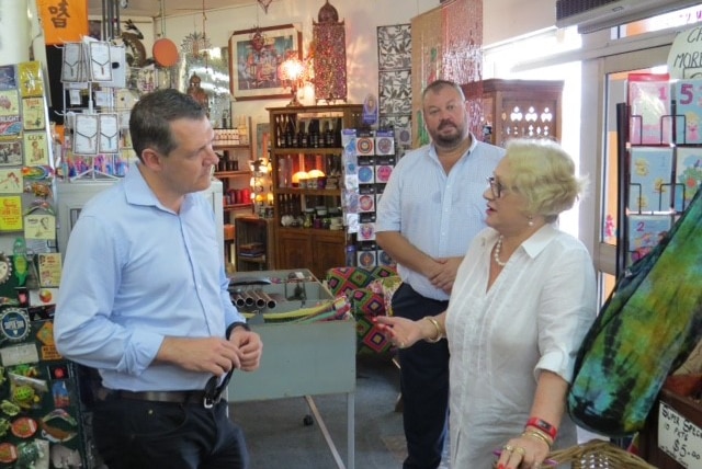 Chief Minister Michael Gunner listening to a business owner talk