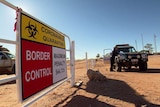 Police staff a border checkpoint at Barringun in south-west Queensland, August 2020