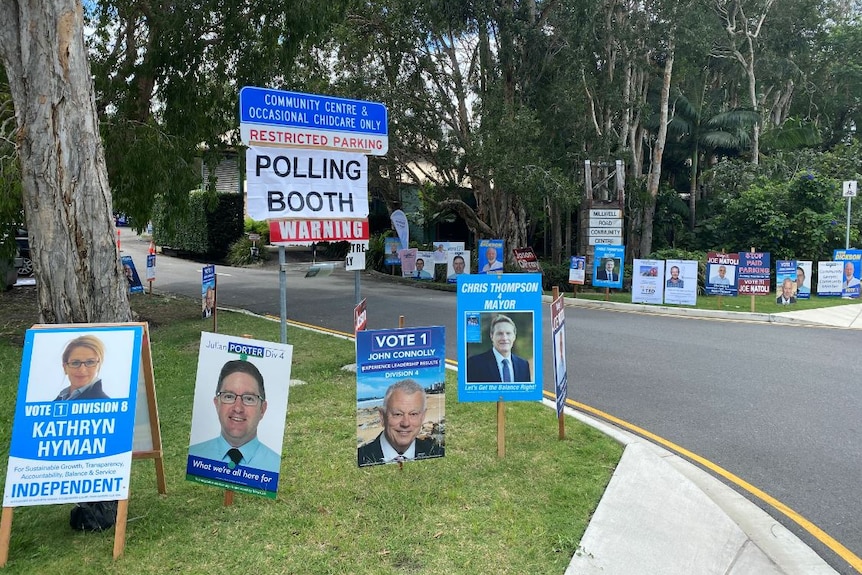 Lots of election campaign signs but no people at a road corner