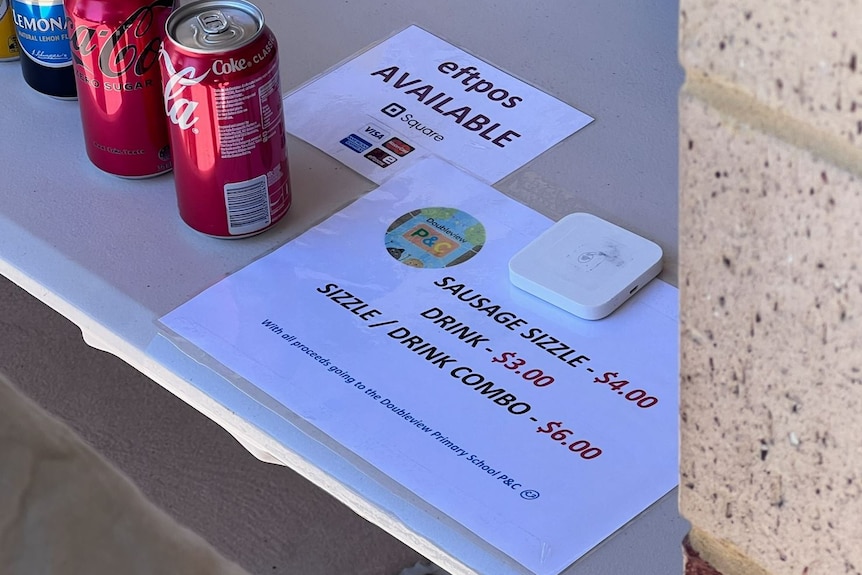 Pictures of sausage sizzle signs