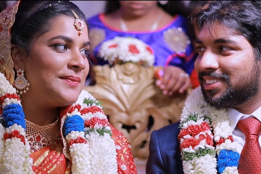 Seeni and Shameina stare lovingly with anticipation into one another's eyes at their wedding