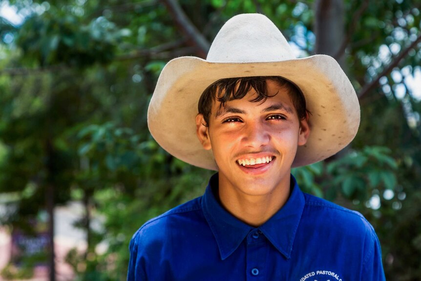 Kununurra teenager Mikey Cox poses, wearing a cowboy hat.