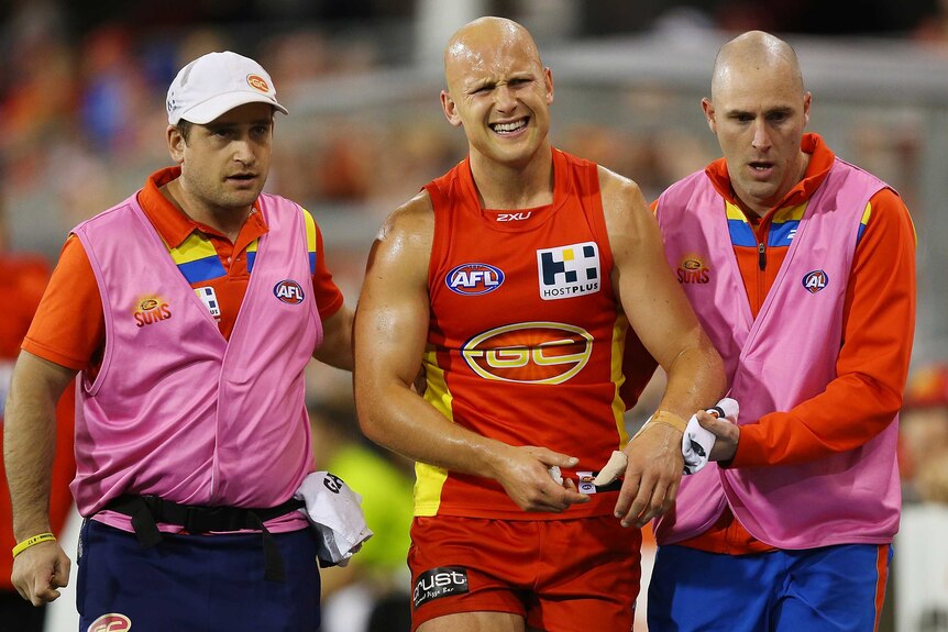 The Suns' Gary Ablett leaves the field injured in the round 16, 2014 game against Collingwood.