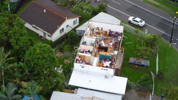A house is left without a roof after a severe storm cell ripped through Townsville