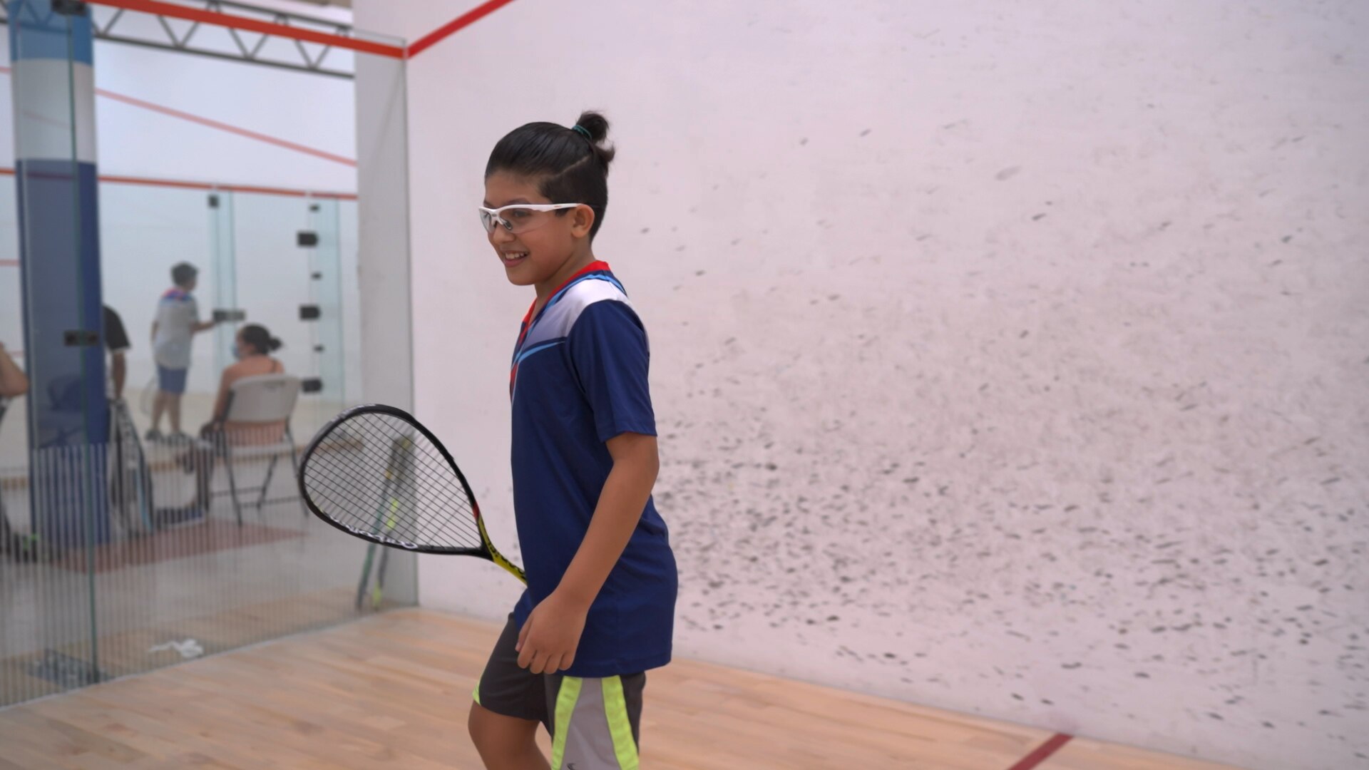 Sami playing squash - ABC News