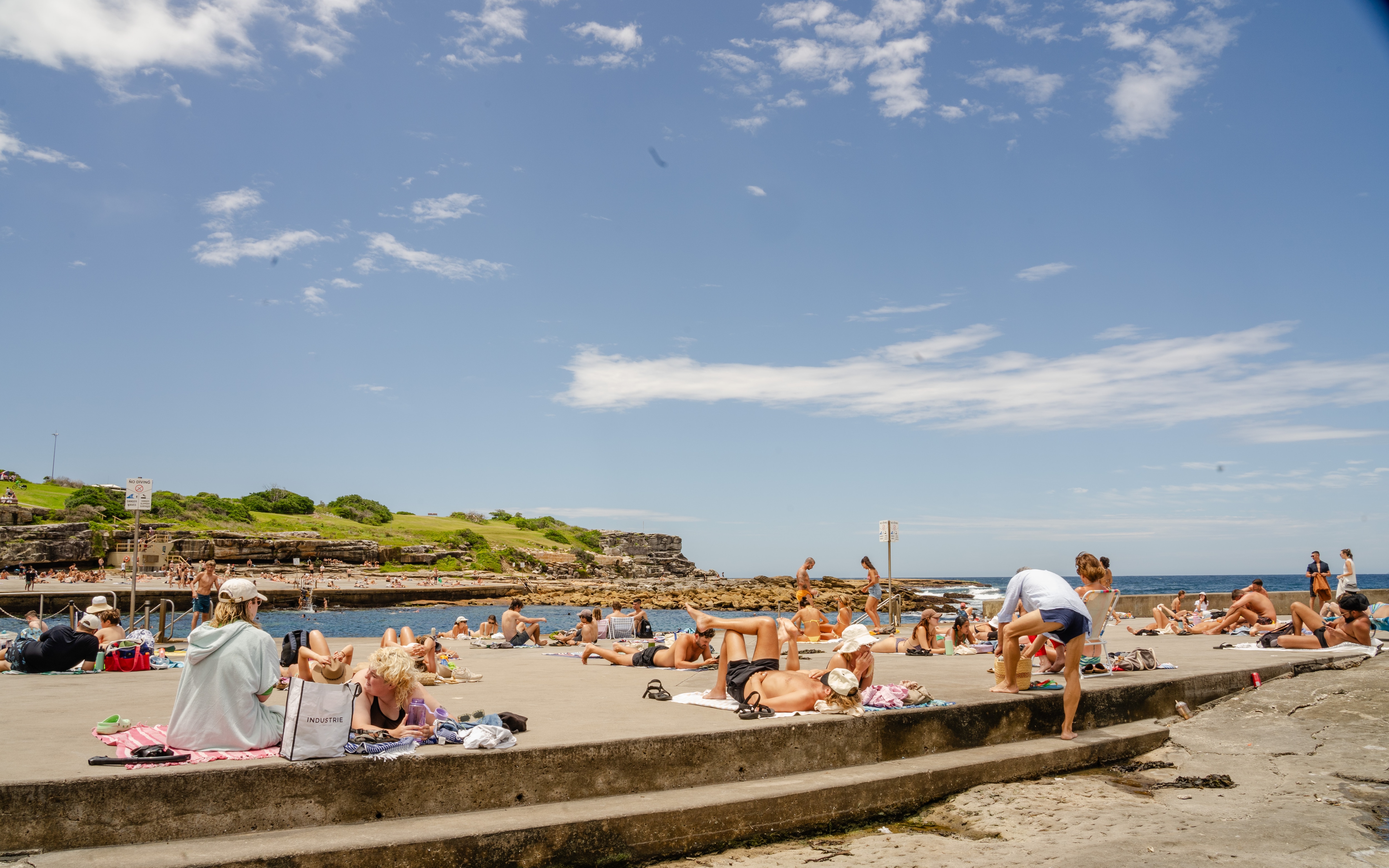 People sunbaking at Clovelly Beach