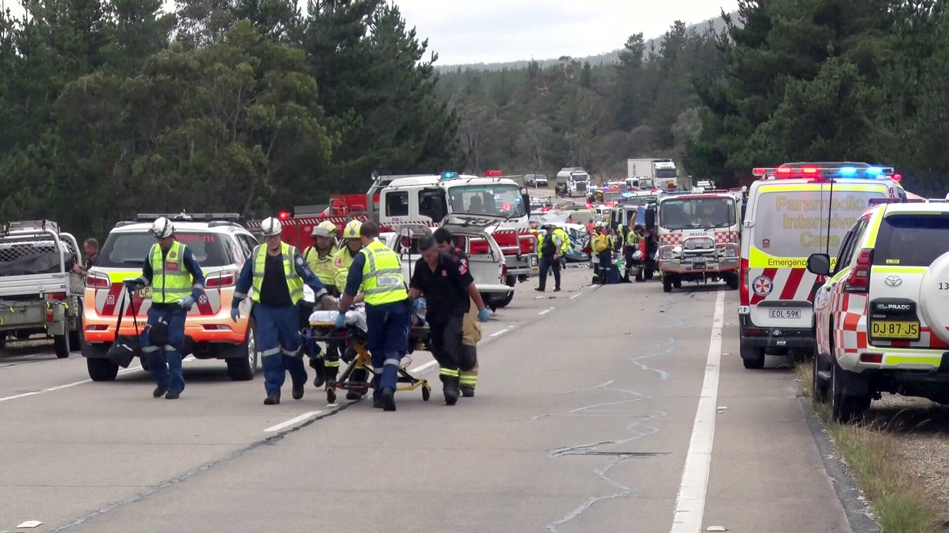 emergency services pull a stretcher carrying a patient after a multi-car crash near lithgow 291223