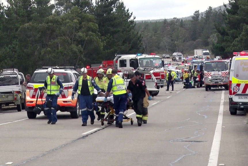 emergency services pull a stretcher carrying a patient after a multi-car crash near lithgow 291223