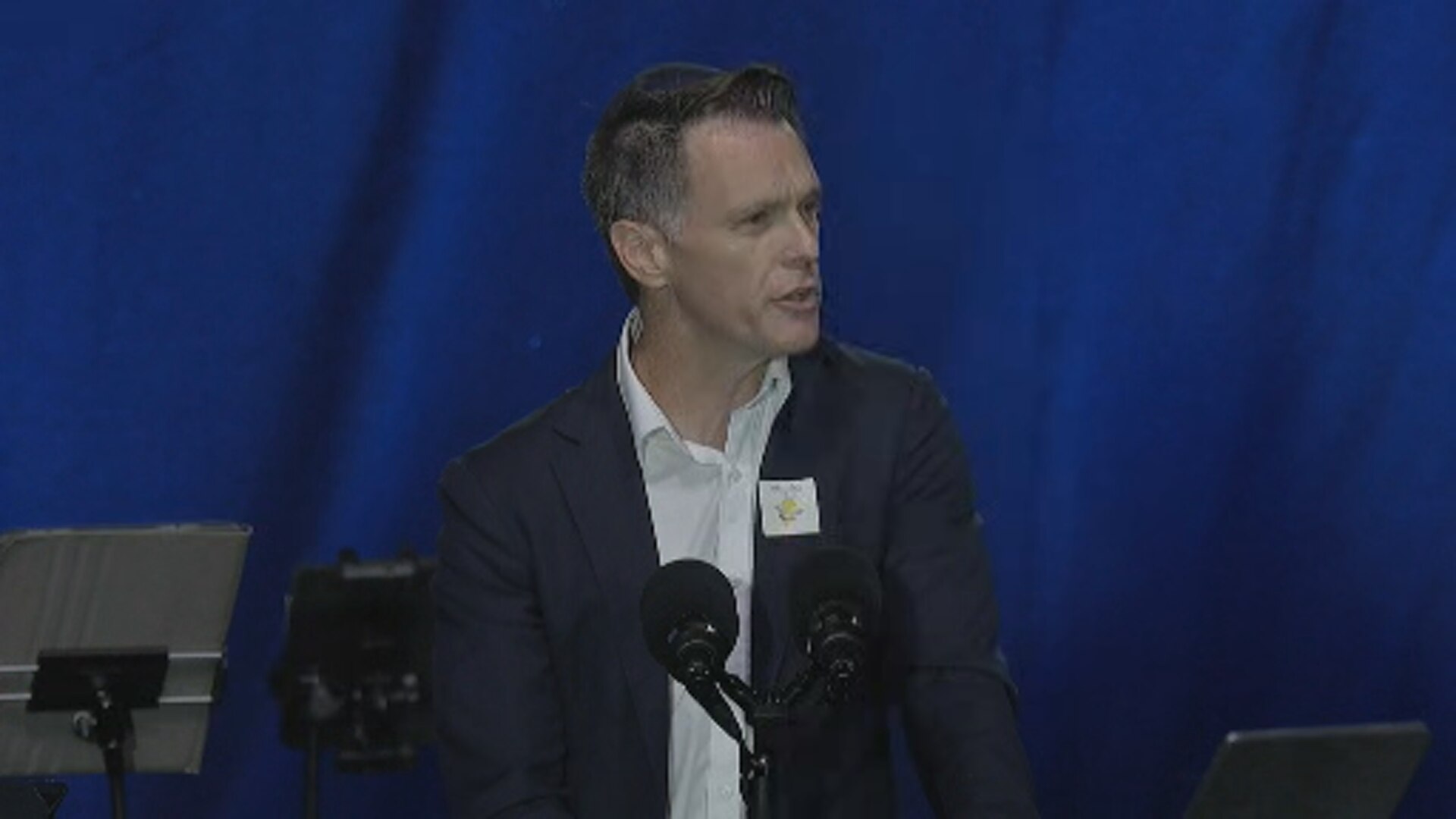 A man standing at a podium talking