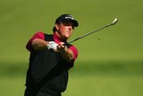 Phil Mickelson plays an iron shot