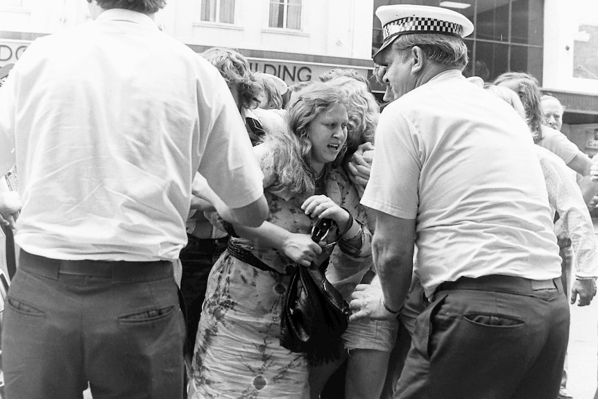 A woman being arrested