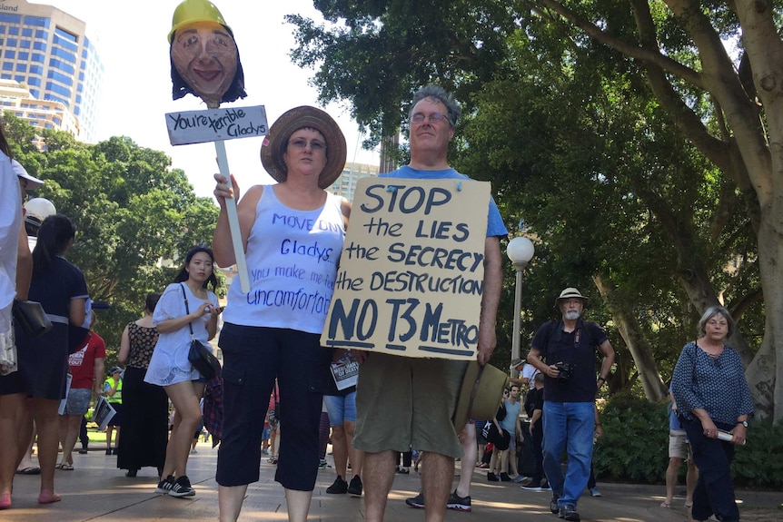 Protesters with Gladys head on stick