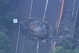 A 300-tonne boulder that fell at Gap Creek Bridge on the Cunningham Highway, near Warwick.