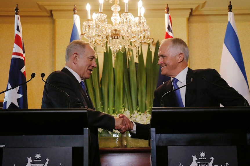 Benjamin Netanyahu and Australian Malcolm Turnbull shake hands at Kirribilli House.