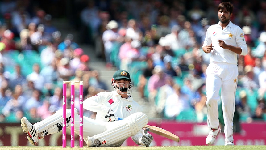 Matt Renshaw falls to the ground after taking a blow to the helmet