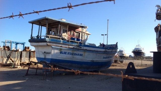 An asylum seeker boat which sailed into Geraldton in 2013 remains sitting in a shipyard 16 months later.