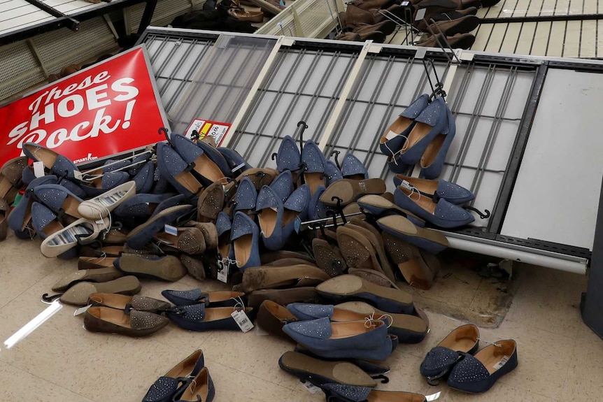 Cabinets carrying shoes are shown knocked over