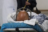 A stereotactic device presses into the head of a brain surgery patient at Ruijin Hospital.