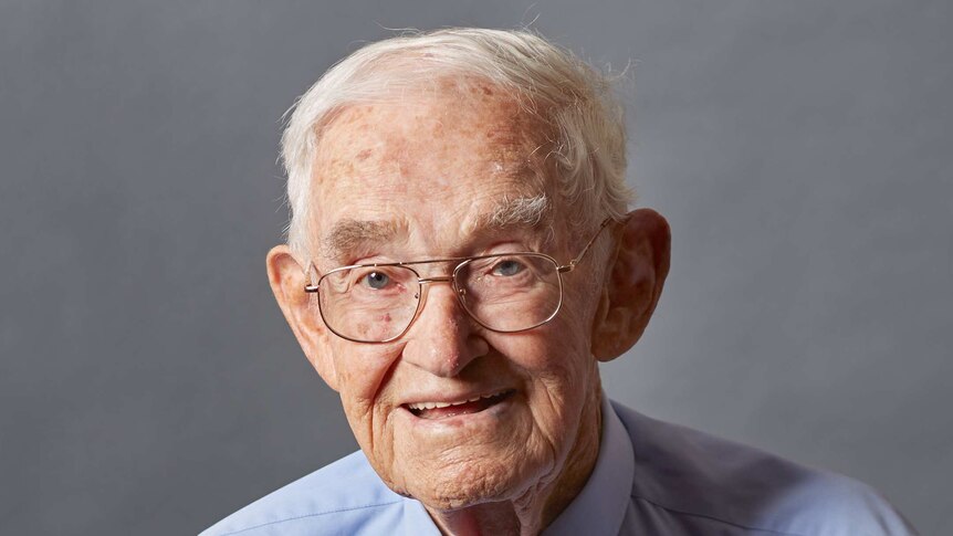 Portrait image of an elderly man wearing war medals
