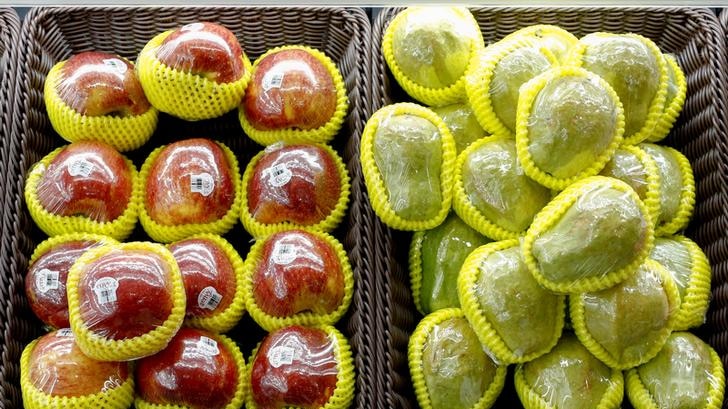 Fruit packaged in plastic are on display at a supermarket in Beijing, China.