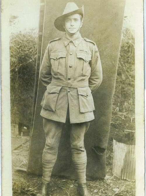 Black and white head to toe grainy picture of Harry Dalziel in full military uniform.