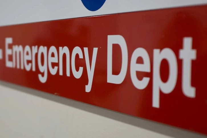 A bright sign that reads "Emergency dept".