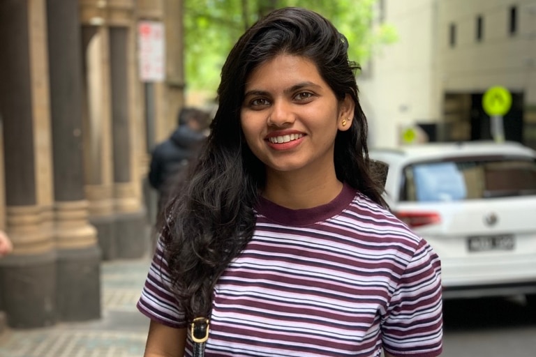 Girl in striped t-shirt smiling