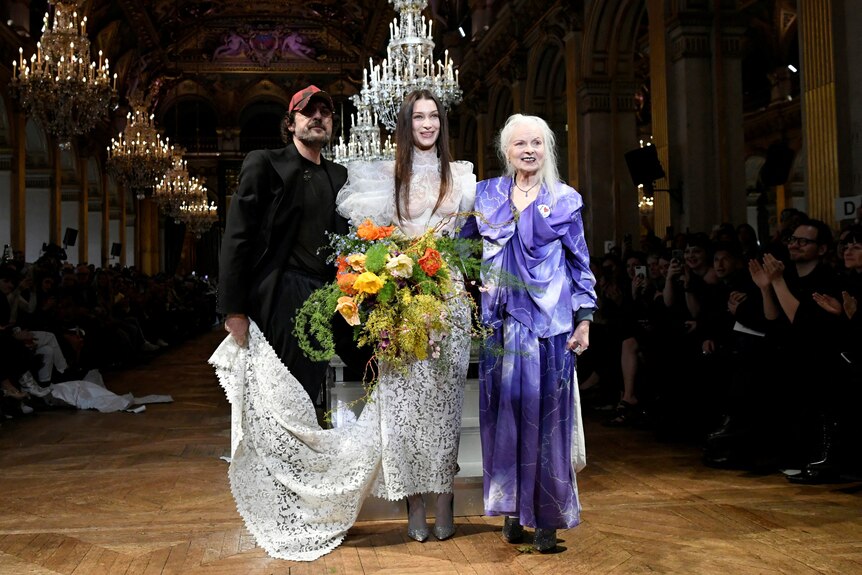  Designers Vivienne Westwood and Andreas Kronthaler pose with model Bella Hadid 