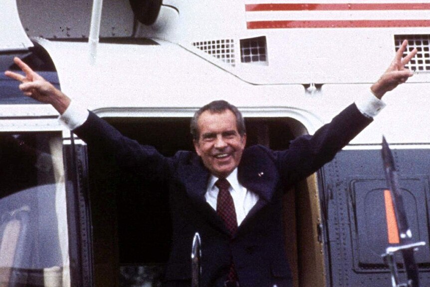 U.S. President Richard M. Nixon flashes the V-for-victory sign.